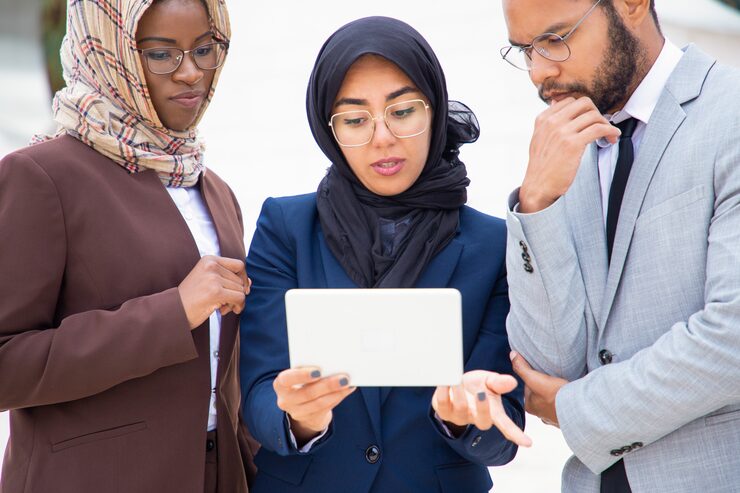 serious-diverse-business-group-watching-discussing-content_74855-1247