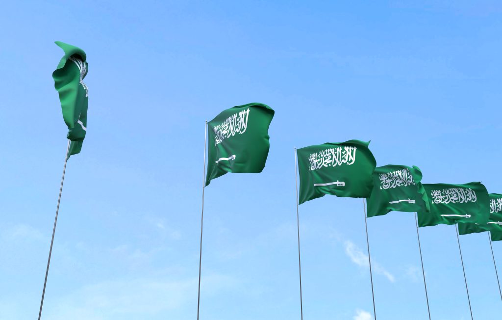 saudi-arabia-flag-waving-blue-sky-background